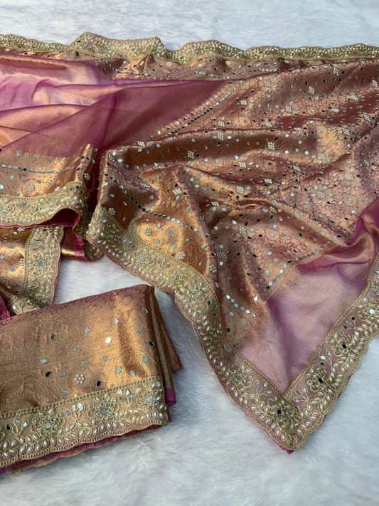 Purple tissue saree with gold embroidered border and scattered stonework