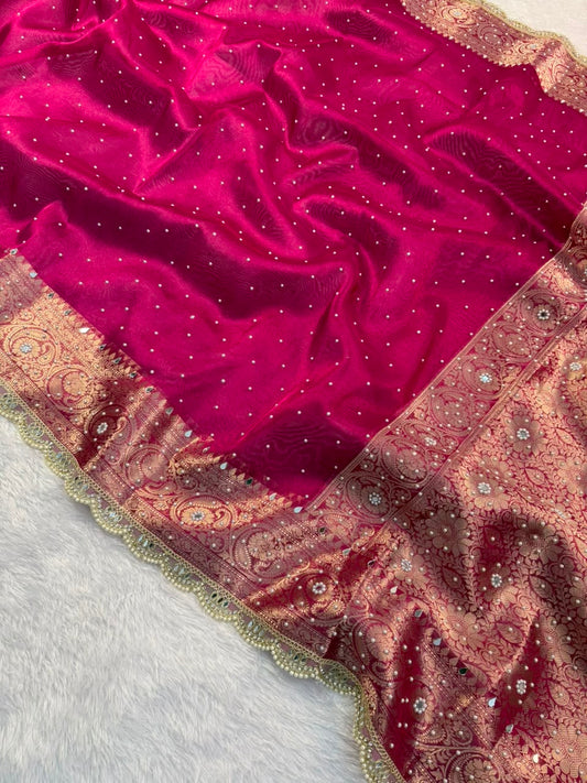 Hot pink tissue saree with detailed gold-toned pallu border and sparkling dots