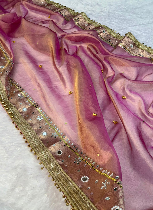 Blush pink tissue saree with gold embellished border and beadwork along the pallu