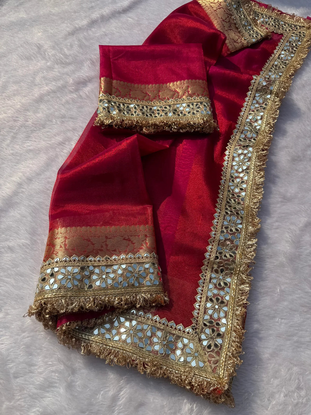 Magenta pink tissue saree with gold and teal embroidered border, embellished pallu