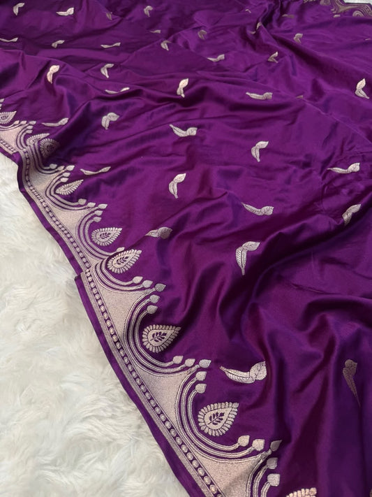 Purple saree with scattered bird motifs and silver-toned ornamental border detail