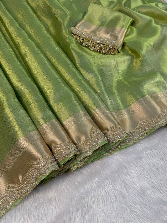 Green tissue saree with gold-beige border and embellished trim edge