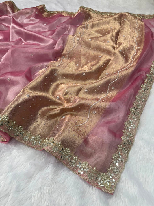 Soft pink tissue saree with gold buti motifs and embellished gold-tone border