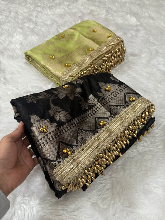 Pastel green and black silk saree folded set with zari borders and gold bead details