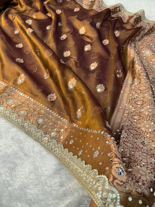 Copper tissue saree close-up: mirror floral motifs with scalloped edge border