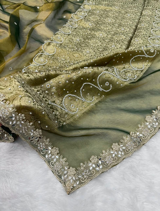 Olive green saree with embellished stone work and scalloped ornate border, draped