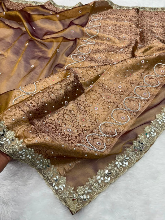 Brown saree with dense gold embroidery, jeweled stone work, and scalloped border, draped