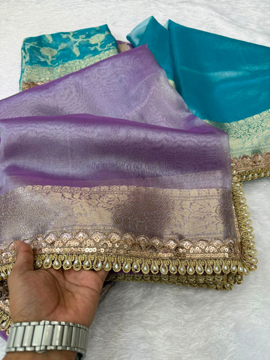 Purple Banarasi tissue saree with gold border and folded sheer fabric texture